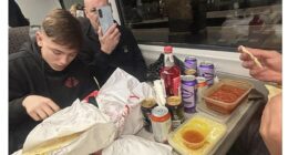 'How can they be so inconsiderate?!': Sunderland football fans bring a full takeaway curry on four-hour train from London - leaving other passengers facing a smelly journey home