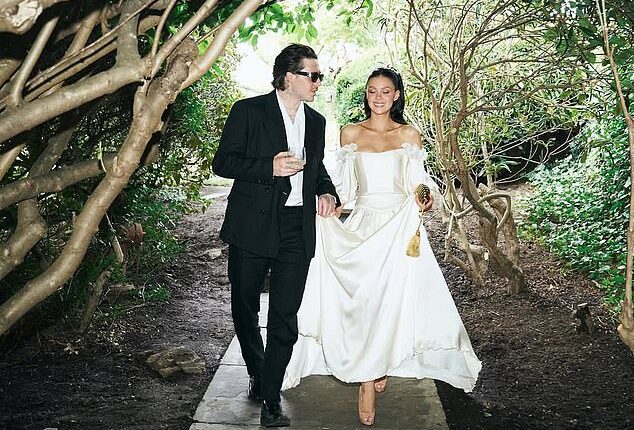 Brooklyn Beckham's claim his mother Victoria pulled out of designing Nicola Peltz's wedding dress at the 'eleventh hour' contradicts what the bride's stylist said (pictured vow renewal)