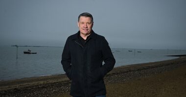 Tony Cottee, pictured on Southend seafront, is still a West Ham season-ticket holder