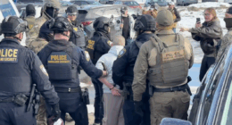 federal law enforcement officers arresting protestor
