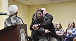 Ilhan Omar was attacked by a man who yelled that she 'should resign' before using a syringe to spray an unknown liquid at the Minnesota Congresswoman