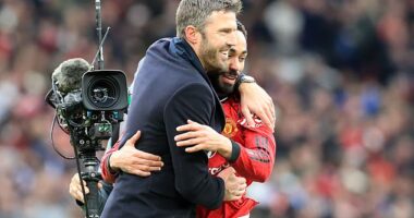 Michael Carrick embraces Matheus Cunha, who starred as a substitute, at the final whistle