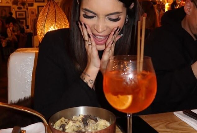 A woman poses up a storm as she enjoys an Italian dinner at one of the Big Mamma restaurants in London