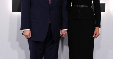 The First Lady donned a buttoned black dress and stilettos as she was joined by her husband who wore his signature navy blue suit