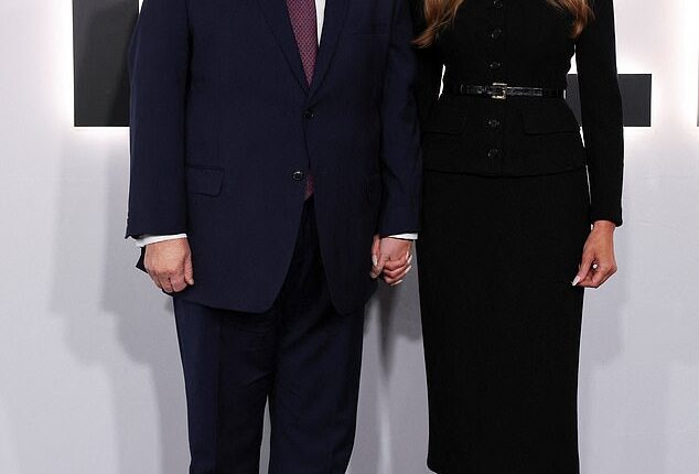 The First Lady donned a buttoned black dress and stilettos as she was joined by her husband who wore his signature navy blue suit