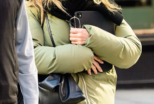 Jennifer Aniston was seen all bundled up for the winter weather while in New York City on Thursday. The 56-year-old Morning Show actress wore a pale green down jacket with a hoodie zipped all the way up