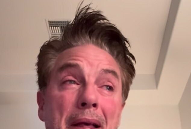 John Barrowman broke down in tears in an emotional video on Monday, as he cradled the body of his dog and announced the Jack Russell had passed away