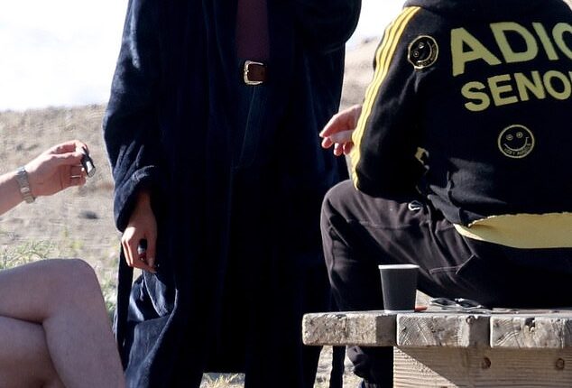 Kaia Gerber seemed to be living her best life as she was spotted happily puffing on what looked like a cigarette between takes of her new Ryan Murphy drama