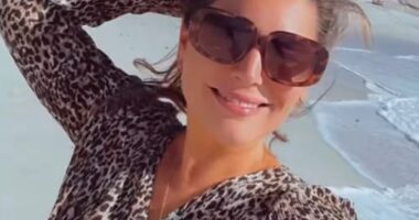 Kelly Brook was making the most of her time in Cape Town this weekend as she enjoyed a boozy dance at a lunch spot before strolling along a picturesque beach