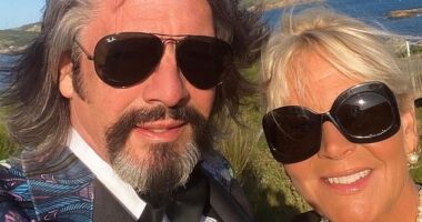 Laurence Llewelyn-Bowen has hit back at critics who think his unconventional living situation is 'strange' (pictured with his wife Jackie)