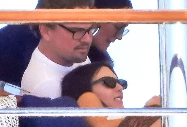 Leonardo DiCaprio and his much-younger girlfriend Vittoria Ceretti looked cozy as they cuddled on board Jeff Bezos' mega boat, with her head resting near his lap