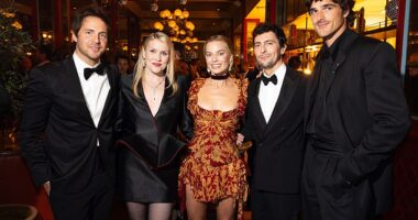 A body language expert has claimed Tom Ackerley made a 'cry for help' in an awkward snap with wife Margot Robbie and Jacob Elordi (L-R Tom, Emerald Fennell, Margot, Josey McNamara and Jacob)