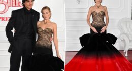 Margot Robbie rocks crimson and black look alongside Jacob Elordi at 'Wuthering Heights' premiere