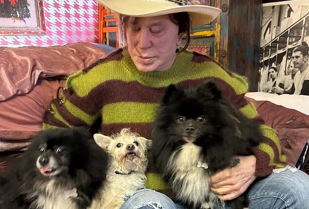 Mickey Rourke is pictured with his dogs Egor, Ivan and Lucky in 2023; Ivan, one of the black and white canines, now has a heart condition requiring a $10,000 surgery
