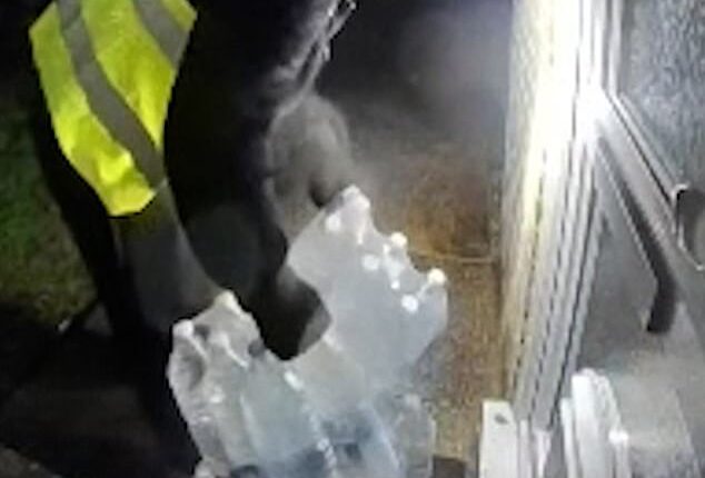 Moment delivery man removes water bottles from doorstep of Kent home that's been left without supply for more than a week