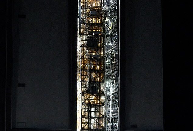 Pictured: Early in the morning on Saturday, January 17, NASA begins to move the Artemis II rocket out of the Vehicle Assembly Building at NASA's Kennedy Space Center. Next month, it will be used for the first manned-mission to the moon since 1972