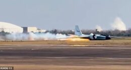 Footage captured the moment the plane skidded across the runway, leaving a trail of flames behind