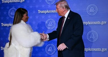 Nicki Minaj is President Donald Trump's No.1 fan. The rapper unexpectedly joined the President on stage Wednesday in Washington, DC for an event on Trump Accounts. She emerged in a furry white coat and with her multi-inch-long acrylic nails took Trump's hand, which is prone to bruising and bleeding due to his high aspirin dose. Trump praised Minaj for investing hundreds of thousands into accounts for her supporters' children, then went off script to invite her on stage alongside businessman and Daily Mail contributor Kevin O'Leary. Minaj, who appeared shier-than-usual in front of the government and business audience, gushed about Trump despite recent backlash over her outward support for the President. 'I am probably the president's No. 1 fan,' Minaj reaffirmed from the podium in the Andrew W. Mellon Auditorium on Wednesday. 'And that's not going to change.'