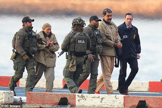 Nicolás Maduro and his wife, Cilia Flores, are seen in handcuffs after landing at a Manhattan helipad as they make their way to a Federal courthouse in Manhattan on January 5, 2026