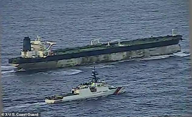 New footage has emerged showing the US Coast Guard chasing down the rogue vessel linked to Venezuelan oil before seizing it during a dramatic commando-style raid