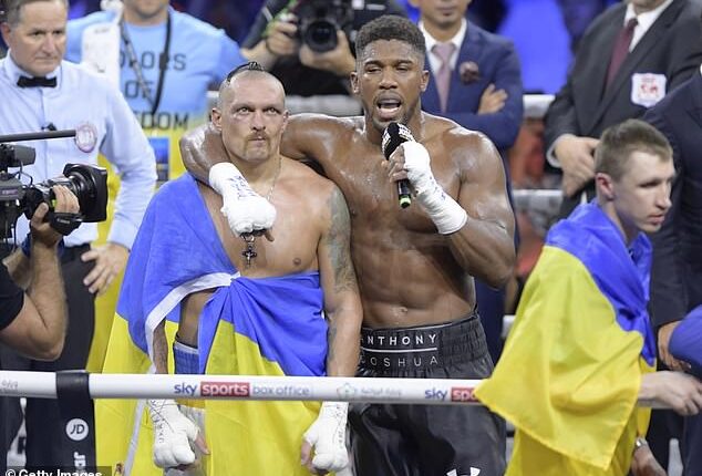 Anthony Joshua (right) pictured with Oleksandr Usyk (left) after their 2022 rematch that the Ukrainian won. Usyk believes AJ will keep fighting after the death of his friends