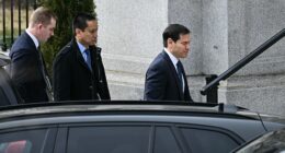 US Secretary of State Marco Rubio (R) arrives at the Eisenhower Executive Office Building on the White House campus ahead of a scheduled meeting with US Vice President JD Vance, Danish Lars Løkke Rasmussen and Greenland's Foreign Minister Vivian Motzfeldt in Washington, DC, on January 14, 2026