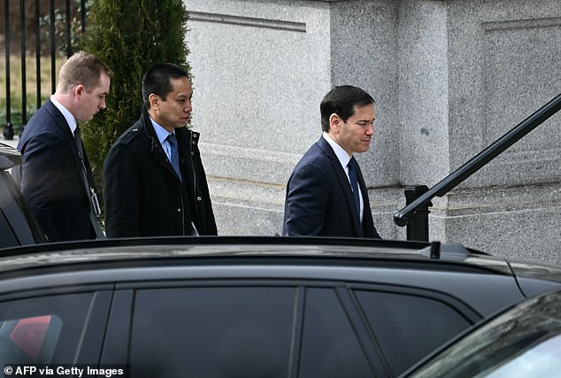 US Secretary of State Marco Rubio (R) arrives at the Eisenhower Executive Office Building on the White House campus ahead of a scheduled meeting with US Vice President JD Vance, Danish Lars Løkke Rasmussen and Greenland's Foreign Minister Vivian Motzfeldt in Washington, DC, on January 14, 2026