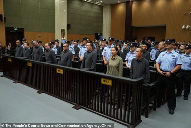 China has executed 11 people linked to Myanmar criminal gangs, including 'key members' of telecom scam operations (pictured, some of the crime family at their sentencing in October at the Wenzhou Intermediate People's Court in eastern China's Zhejiang Province)
