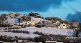 Snow covers the hills of North Wales in Mold this morning as Met Office warnings are activated