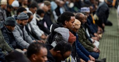 Men take part in a weekly Friday Jum'ah prayer session at Abubakar As-Saddique Islamic Centre amid a reported ongoing federal immigration operation targeting the Somali community in Minneapolis on December 5