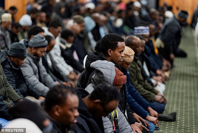 Men take part in a weekly Friday Jum'ah prayer session at Abubakar As-Saddique Islamic Centre amid a reported ongoing federal immigration operation targeting the Somali community in Minneapolis on December 5