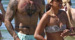 Spanian (left) accidentally gave onlookers an eyeful when his boardshorts turned see-through unexpectedly during a swim at Balmoral Beach with his girlfriend Ava Jean Walker (right)