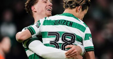 Arne Engels is all smiles as he gives fellow Celtic goalscorer Daizen Maeda a lift at Parkhead