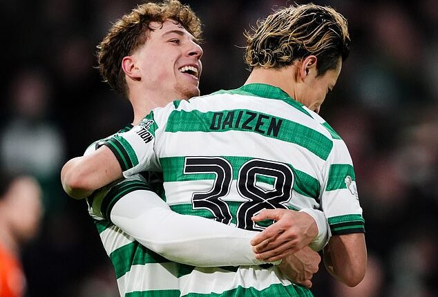 Arne Engels is all smiles as he gives fellow Celtic goalscorer Daizen Maeda a lift at Parkhead