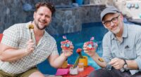 Hunter Cope and David Wain pose with their parfaits poolside in the comedy interview series The Perfect Parfait.