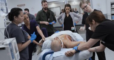 With much lugging and Mel's hand on bone assist, the team manages to rest Billing's arm.