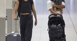 Sam Kerr shared a tender moment with son Jagger as she and wife Kristie Mewis flew out of Perth after their wedding on New Year's Eve