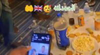 Suspected migrants have shared a video of themselves eating food at a social gathering in what is suspected to be temporary accommodation in Britain