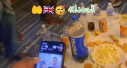 Suspected migrants have shared a video of themselves eating food at a social gathering in what is suspected to be temporary accommodation in Britain