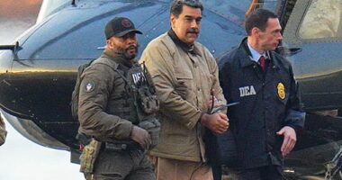Nicolas Maduro is seen in handcuffs after landing at a Manhattan helipad, escorted by heavily armed Federal agents as they make their way into an armored car en route to a Federal courthouse in Manhattan on January 5, 2026 in New York City