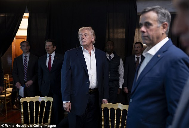 Donald Trump said while he was watching the Nicolas Maduro capture operation he was worried if it failed he would be compared to Jimmy Carter and Joe Biden. Pictured: Trump watches from his Mar-a-Lago 'situation room' with CIA Director John Ratcliffe (right) as special forces captured and extracted Maduro and his wife Cilia Flores
