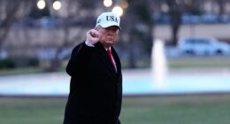 President Donald Trump gestures as he walks from Marine One after arriving on the South Lawn of the White House, Tuesday, Jan. 13, 2026, in Washington