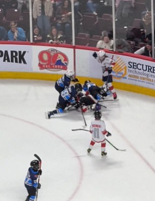 A massive brawl broke out in a kids' hockey game on Saturday night with thousands watchin