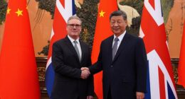 Britain's Prime Minister Keir Starmer shakes hands with Chinese President Xi Jinping ahead of a bilateral meeting during his visit to China