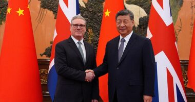 Britain's Prime Minister Keir Starmer shakes hands with Chinese President Xi Jinping ahead of a bilateral meeting during his visit to China