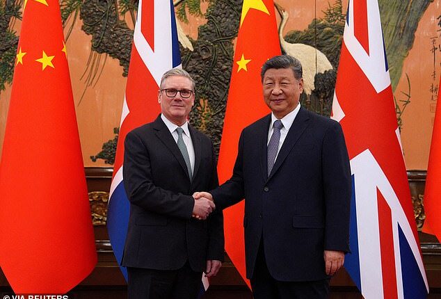Britain's Prime Minister Keir Starmer shakes hands with Chinese President Xi Jinping ahead of a bilateral meeting during his visit to China
