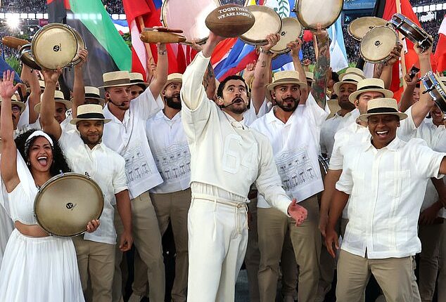 Puerto Rican rapper Bad Bunny held up a football with the message 'Together we are America' during his Super Bowl halftime show