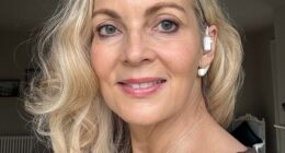 Alice Smellie with her Sona – a vagus nerve-stimulating earpiece – which she believes has given her a calmer outlook