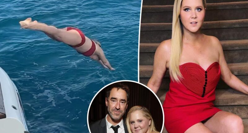 Amy Schumer makes a splash in red hot bikini after first solo Valentine's Day since split