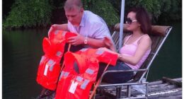 Pictured: A seemingly unaware Andrew enjoying a ride on a bamboo river raft